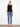 Stylish button-up crochet top paired with jeans, showcasing a modern sleeveless style by Charlie B.