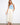 Natural twill pants featuring a straight fit and styled with a light blue top and sandals. Made for comfort by Charlie B.