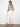 Straight leg design in natural twill pairs effortlessly with sandals and a chic light blue top for versatile wear. By Charlie B.