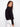 The classic short length of the jacket provides an elegant silhouette suitable for various occasions and styles. By Charlie B.