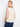 Fog-colored top showcasing decorative back buttons and a flattering scallop hem design by Charlie B.