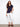 Navy short-sleeve T-shirt styled with white pants, offering a comfortable and chic appearance by Charlie B.