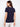 Casual navy T-shirt in a relaxed fit, made from linen blend and styled with white pants for comfort by Charlie B.