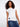 This white top features a charming heart-shaped cutout detail, adding a playful touch to any outfit. Made by Charlie B.