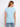 Crafted from 100% cotton, this light blue top offers both comfort and durability for everyday wear. Designed by Charlie B.