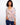 Floral blouse with a Henley neckline, showcasing vibrant patterns and adjustable roll-up sleeves for versatile styling by Charlie B.