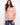 Colorful abstract print blouse with relaxed fit and elbow-length dolman sleeves, made from a lightweight cotton blend by Charlie B.