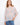This top features a crew neckline, offering a classic and versatile style. Made by Charlie B.