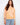 Soft orange top with a crew neckline, featuring a stylish reversed print. Perfect for casual outings. Made by Charlie B.