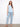 Chic high-low hem top in soft blue, offering a relaxed fit and versatile style for any casual outing. By Charlie B.