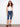 Stylish woman in cuffed hem denim pedal pushers, ideal for summer wear by Charlie B.
