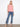 Chic pink top with a scallop hem adds a touch of elegance to your wardrobe essentials. By Charlie B.