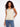 Gold sweater cami featuring a stylish V-neck and heart detail, perfect for layering by Charlie B.